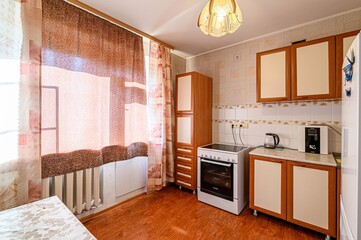 interior apartment kitchen and dining room, refectory area, cooking equipment, table furniture, stove