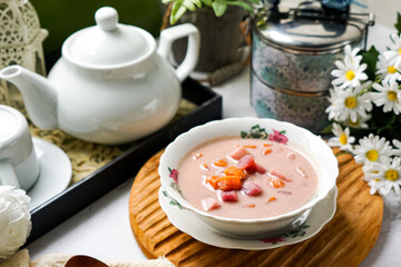 Bubur Cha Cha is a creamy coconut dessert with colorful cubes of purple, orange, and white sweet potatoes and yam. A traditional Southeast Asian dessert, particularly popular in Malaysia and Singapore