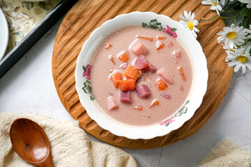 Bubur Cha Cha is a creamy coconut dessert with colorful cubes of purple, orange, and white sweet potatoes and yam. A traditional Southeast Asian dessert, particularly popular in Malaysia and Singapore
