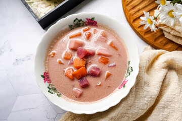 Bubur Cha Cha is a creamy coconut dessert with colorful cubes of purple, orange, and white sweet potatoes and yam. A traditional Southeast Asian dessert, particularly popular in Malaysia and Singapore