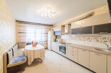 interior apartment kitchen and dining room, refectory area, cooking equipment, table furniture, stove