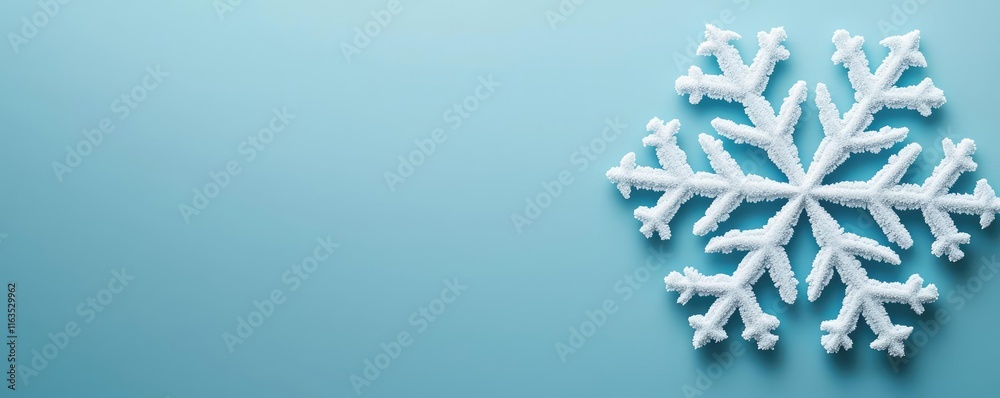 Poster Snowflake abstract background idea. A delicate snowflake against a soft blue background, symbolizing winter's beauty.