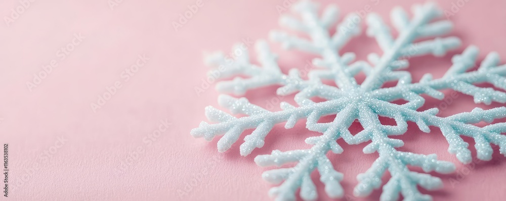 Poster Snowflake abstract background idea. Delicate snowflake on a soft pink background, symbolizing winter and seasonal beauty.