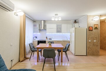 interior apartment kitchen and dining room, refectory area, cooking equipment, table furniture, stove