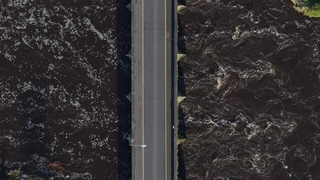 Road Bridge Spanning The Boyne River In Daytime. - aerial overhead shot