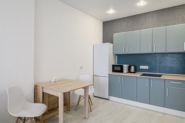 interior apartment kitchen and dining room, refectory area, cooking equipment, table furniture, stove