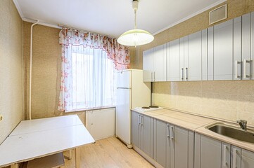 interior apartment kitchen and dining room, refectory area, cooking equipment, table furniture, stove