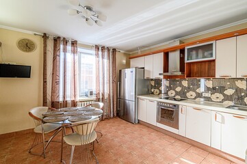 interior apartment kitchen and dining room, refectory area, cooking equipment, table furniture, stove