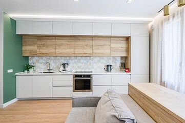 interior apartment kitchen and dining room, refectory area, cooking equipment, table furniture, stove