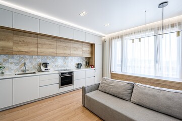 interior apartment kitchen and dining room, refectory area, cooking equipment, table furniture, stove