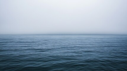 Fototapeta premium Serene Ocean Under a Misty Sky