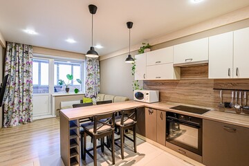 interior apartment kitchen and dining room, refectory area, cooking equipment, table furniture, stove