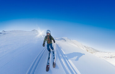 Male skier rides unprepared snow