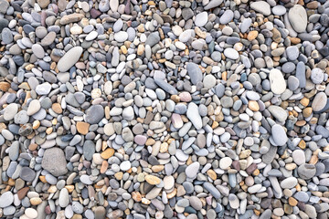 Background texture of sea pebbles, round small stones.