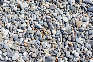 Background texture of sea pebbles, round small stones.