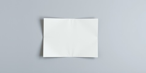 Fototapeta premium Blank folded paper mockup on a neutral background, perfect for showcasing your design or branding