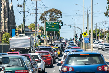 Heavy traffic congestion in Geelong Australia, with multiple lanes of cars waiting at a traffic...