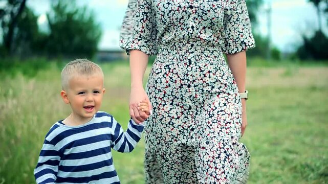 Mothers day . Cute son walking with mother  	