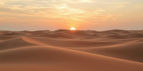 Serene Sunset Over Undulating Sand Dunes in a Vast Desert Landscape