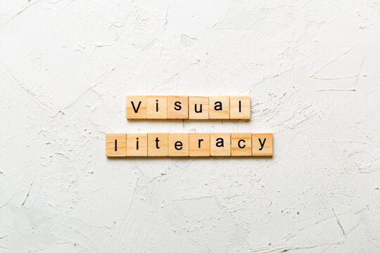 visual literacy word written on wood block. visual literacy text on cement table for your desing, concept