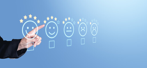 Hand selecting five-star rating on feedback scale with emotive faces.