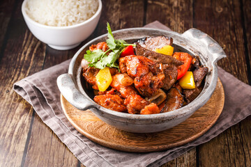 Pork Belly and Pork Ribs Stew with Steamed Rice served in broth isolated on napkin side view of...
