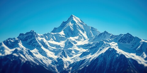 Obraz premium Majestic Winter Mountain Peak and Snowy Range Under a Clear Blue Sky
