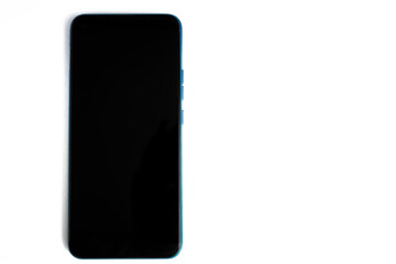 Modern smartphone laid flat on a white background with blank screen