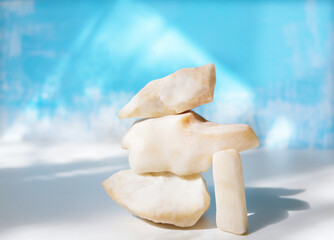 White pink marble stones. Pyramid. Contemporary art. balance, harmony, atmospheric mood. Place for text or presentation beauty product