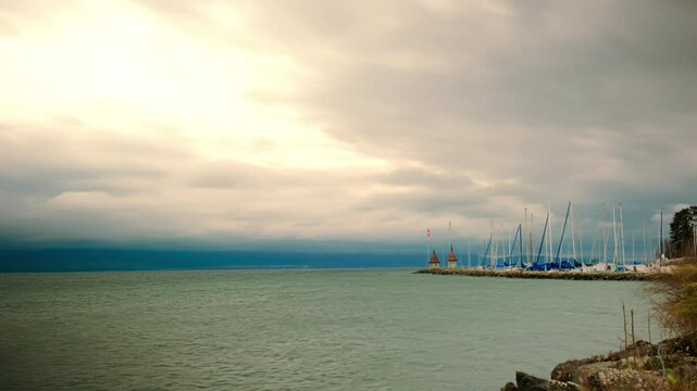 Timelapse of Lake Geneva and Morges port with cloudy sky in Canton of Vaud Switzerland