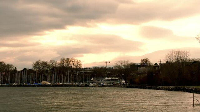 Timelapse of yellow sky over Morges port in Canton of Vaud Switzerland