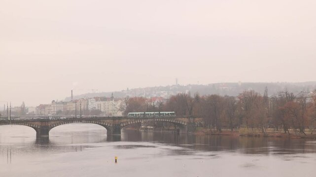 aerial panoramic of Charles Bridge in Prague, Czech Republic during a cold noddy day of winter
