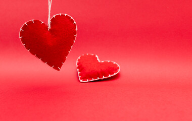 love and relationship abstraction, handmade wool red hearts on red background, dating and...