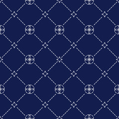 Fototapeta premium Sashiko embroidery seamless vector pattern. Needlework fabric design. Japanese embroidery ornament white stitches on the indigo blue background. 