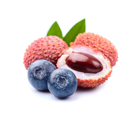 Lychee fruits and blueberries on white backgrounds
