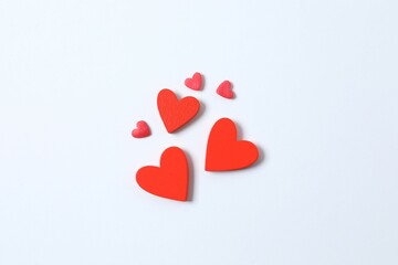 Beautiful red paper hearts on white background