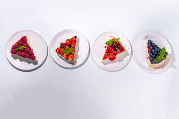 Summer cheesecake slices with various berry
