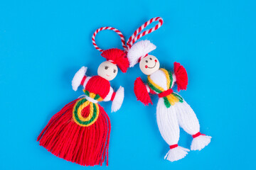 Bulgarian Martenitsa spring sign on blue background