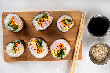 Traditional Korean food kimbap, with ham, vegetables and lettuce