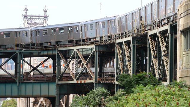 New York elevated subway, metropolitan bridge, metro track above street. Railway transport, vintage Queensboro station railroad line. Queens public train transportation. Long Island city United States