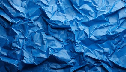 Obraz premium A sheet of blue wrinkled paper texture as background