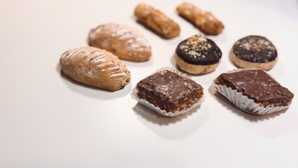 Variety of Traditional Arabic Sweets on White Background: Sweet Delights with Exquisite Flavors.