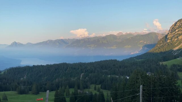 Revealing bench with spectacular panoramic view on alpine valley at Glaubenbielen Pass, Switzerland