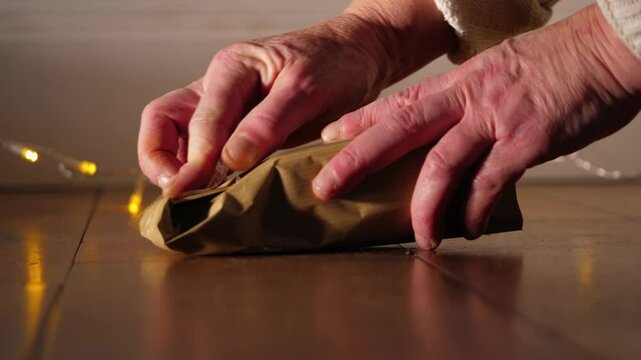 Wrapping gift in brown paper