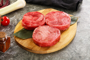 Delicous raw tuna medallion for cooking