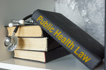 Book about public health law and a stethoscope.