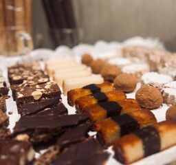 Exquisite Selection of Christmas Nougats on Tray on Decorated Holiday Table.