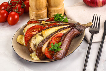 Baked tomato with mozzarella and tomato