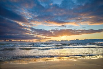 Sea coast. Different sky. Beautiful sunset.