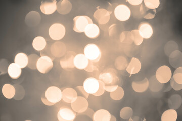 Yellow, orange, sepia, brown bokeh background with soft, circular light spots in varying sizes. The dreamy, out-of-focus effect creates an abstract, atmospheric, and versatile backdrop